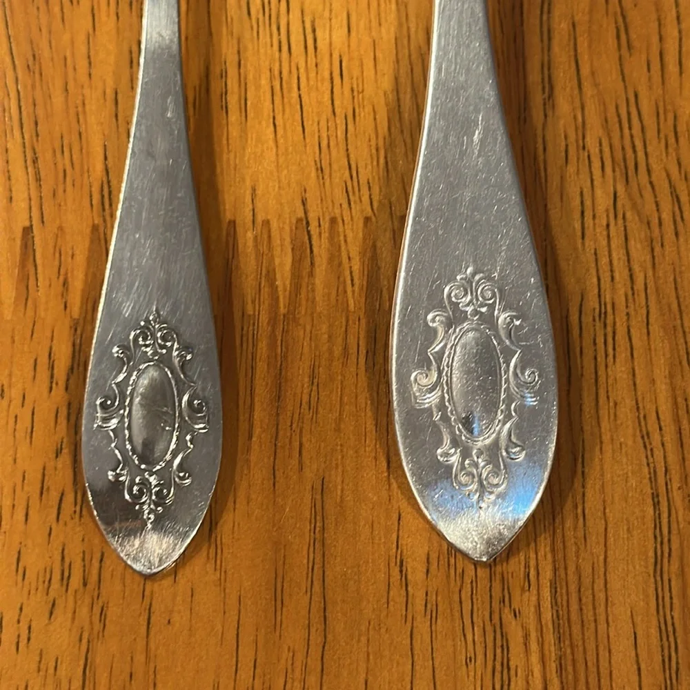 CV silver fork and spreading knife with the same pattern. Early 1900’s